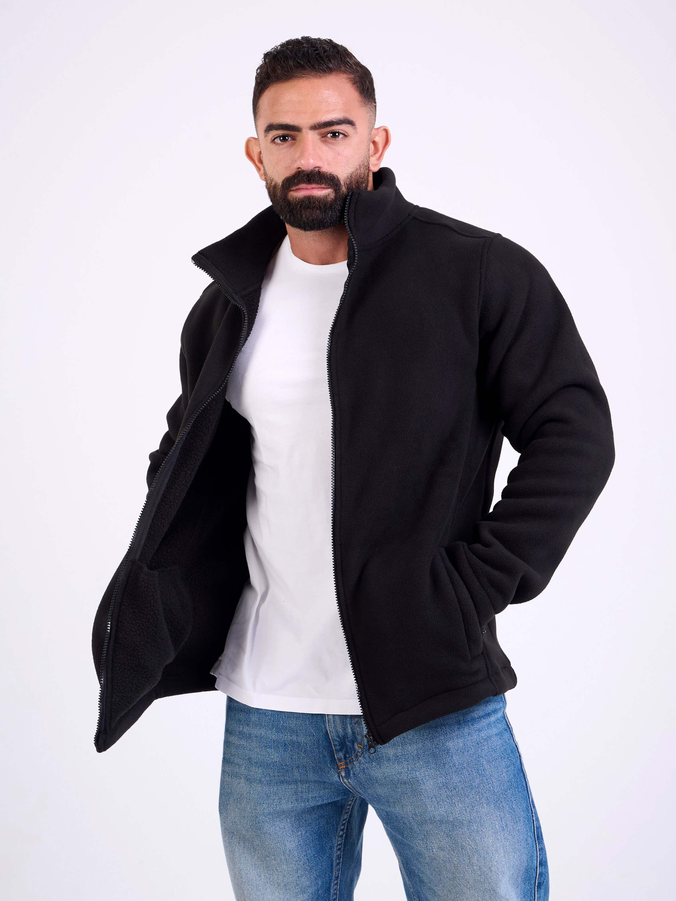 Man wearing a black fleece jacket by KAF on a white background. Made in Egypt