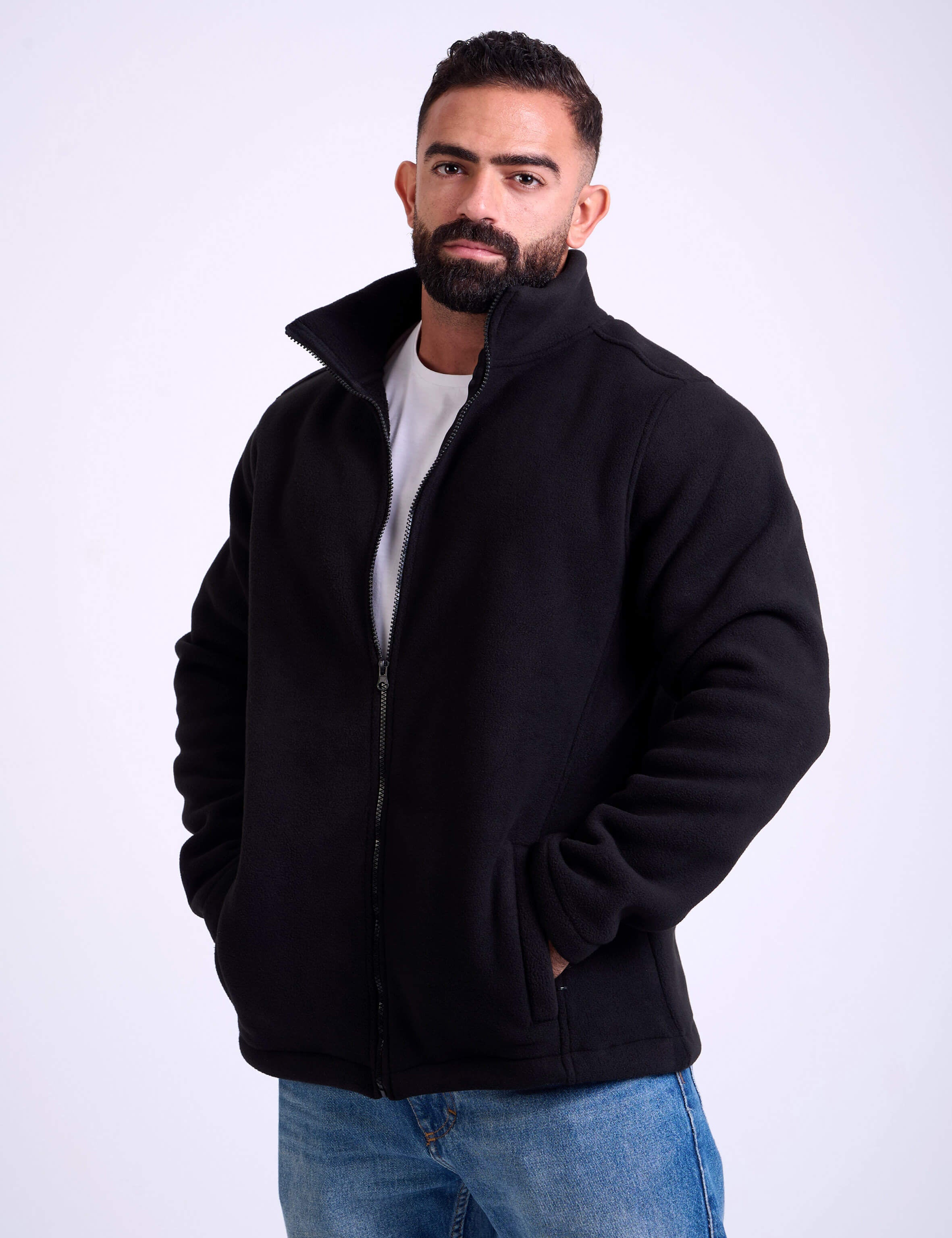 Man wearing a black fleece jacket by KAF on a white background. Made in Egypt