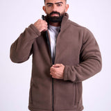 Man wearing a brown fleece jacket by KAF on a white background. Made in Egypt