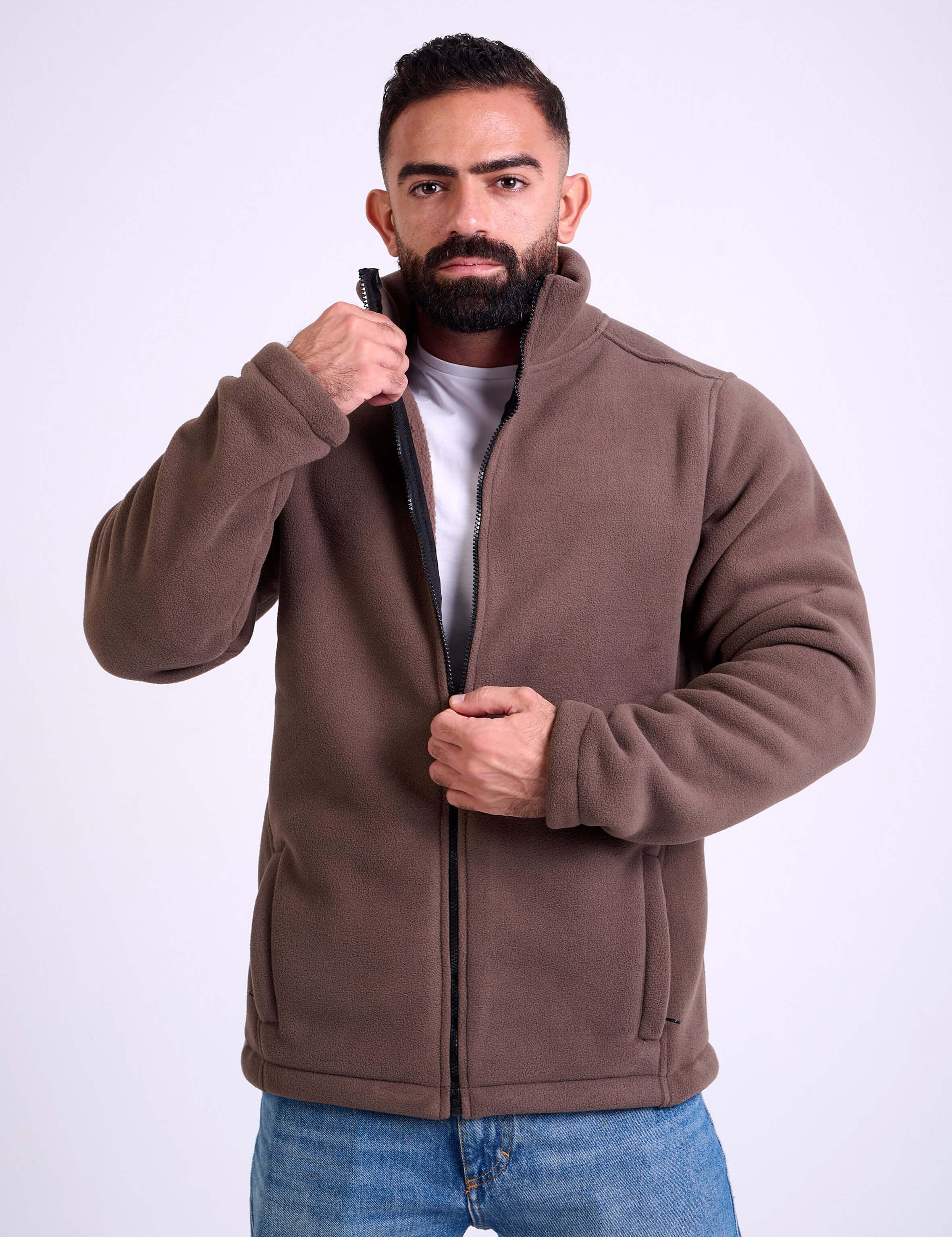 Man wearing a brown fleece jacket by KAF on a white background. Made in Egypt