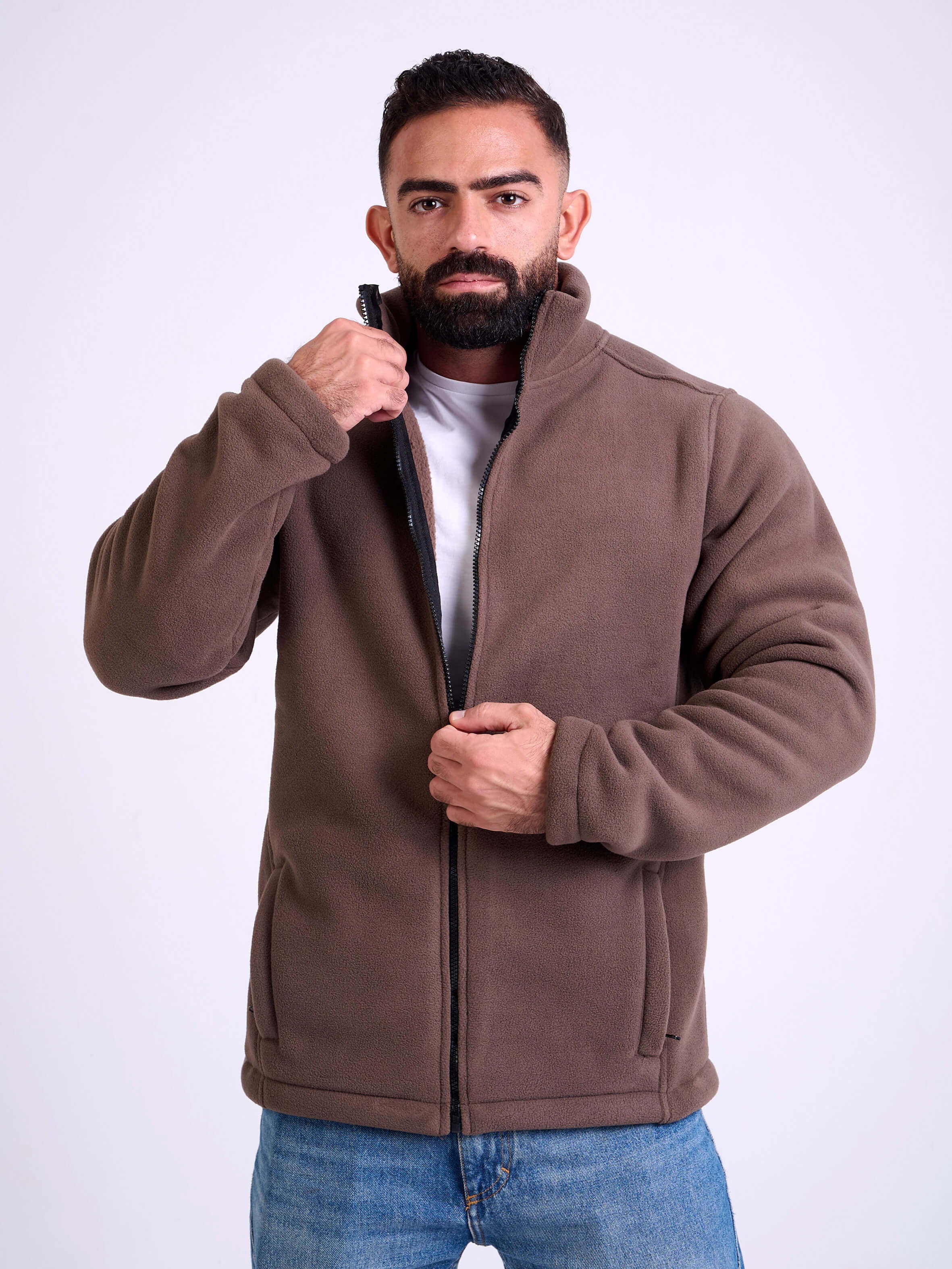 Man wearing a brown fleece jacket by KAF on a white background. Made in Egypt