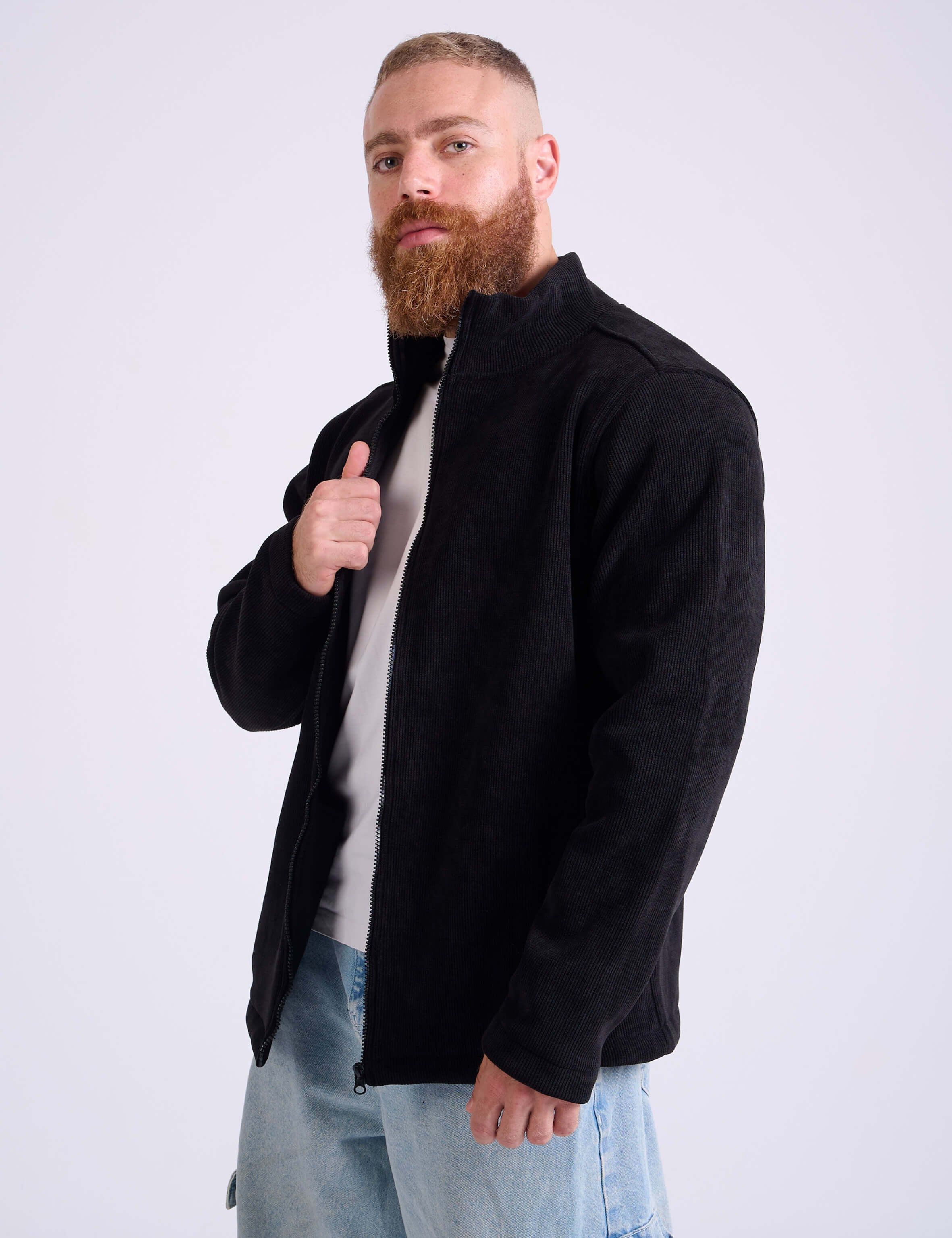Man wearing a black corduroy jacket by KAF on a white background