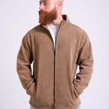 Man wearing a camel beige corduroy jacket on a white background