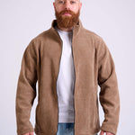 Man wearing a camel beige corduroy jacket on a white background