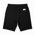 Black shorts with a small logo on a white background