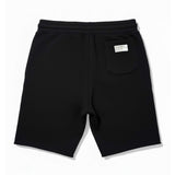 Black shorts with a small logo on a white background