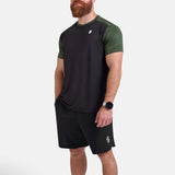 Man wearing black and green sports - gym - padel t-shirt by KAF Egypt