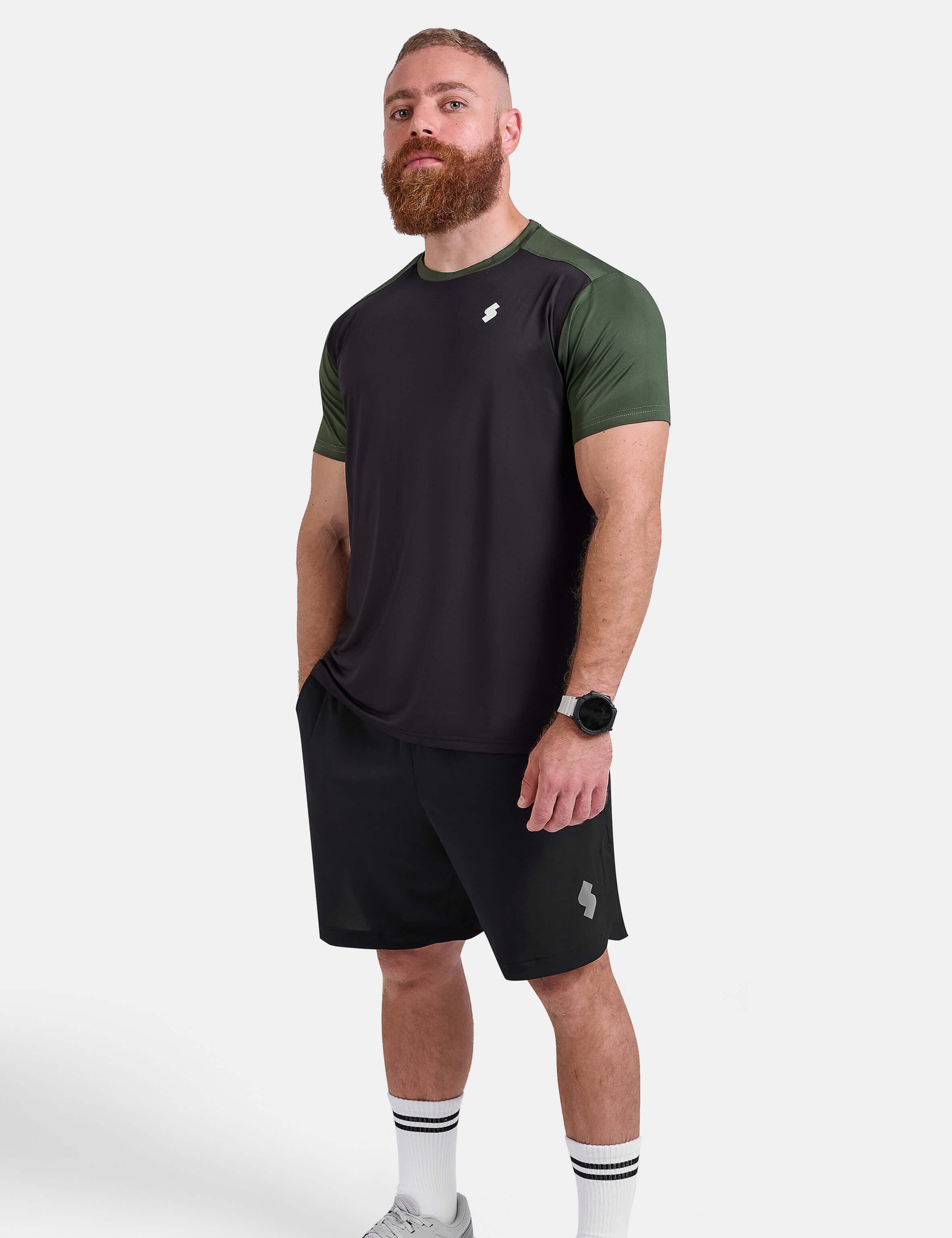 Man wearing black and green sports - gym - padel t-shirt by KAF Egypt