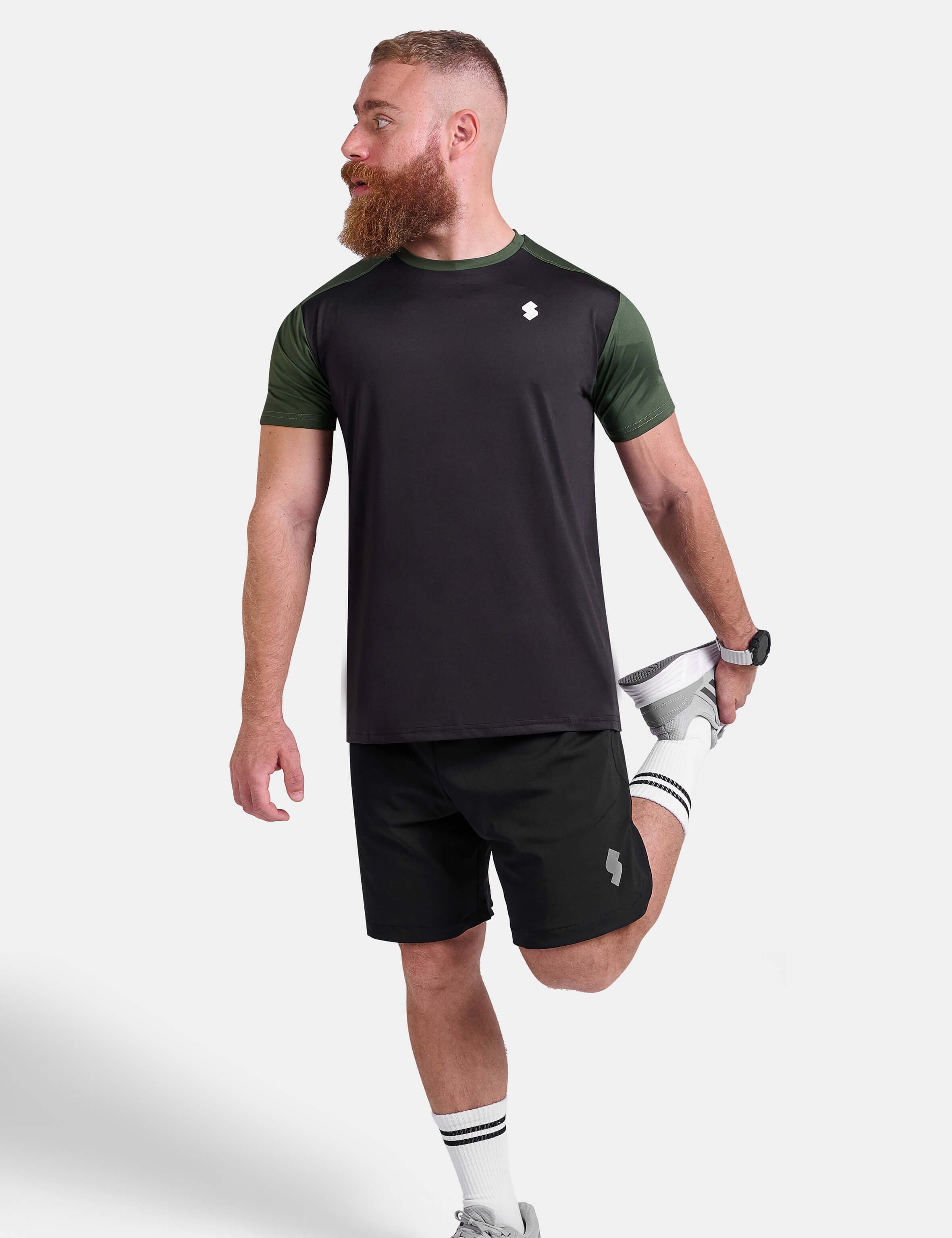 Man wearing black and green sports - gym - padel t-shirt by KAF Egypt