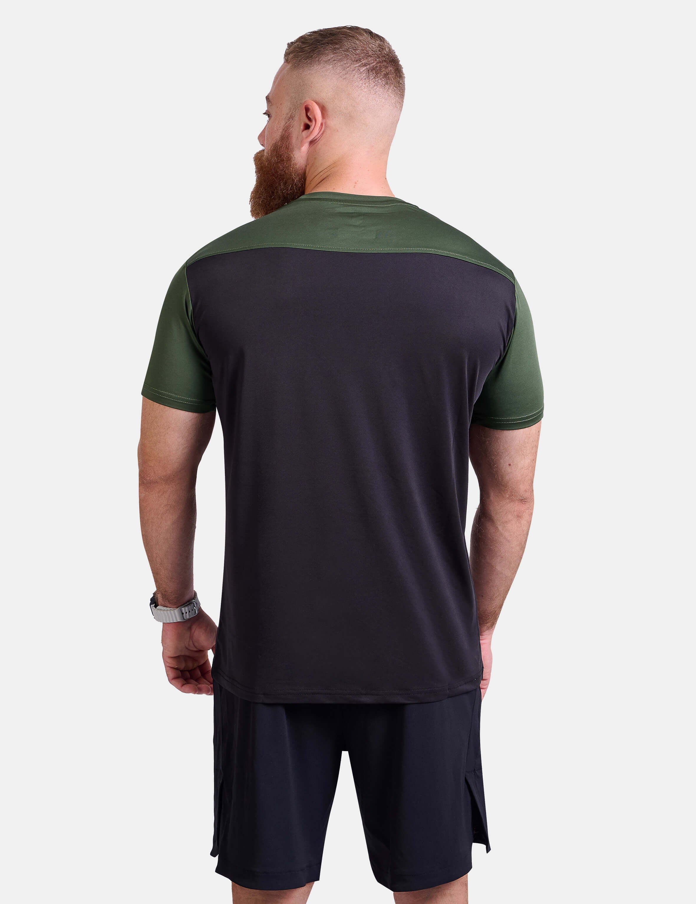Man wearing black and green sports - gym - padel t-shirt by KAF Egypt
