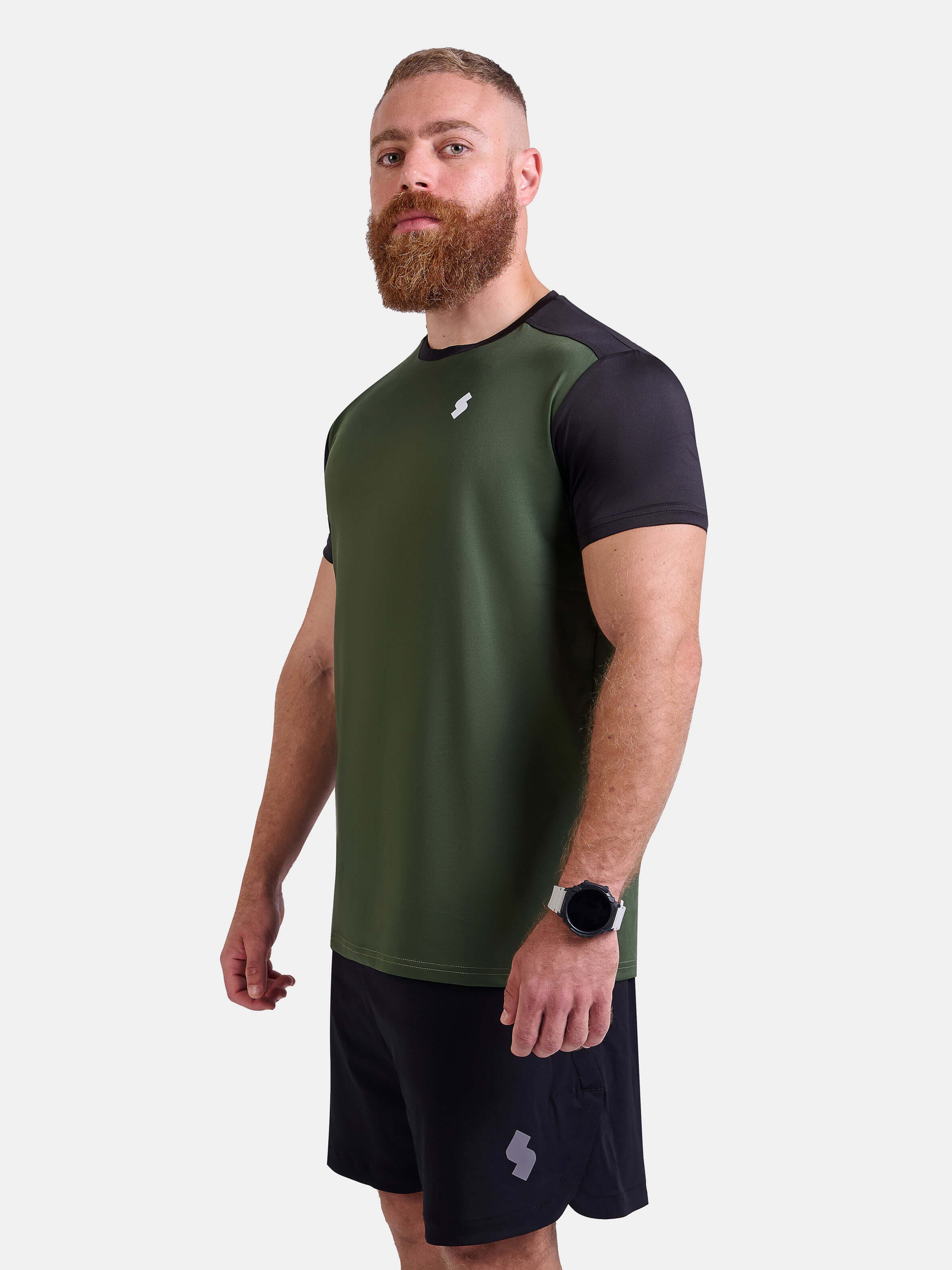 Man wearing black and green sports - gym - padel t-shirt by KAF Egypt