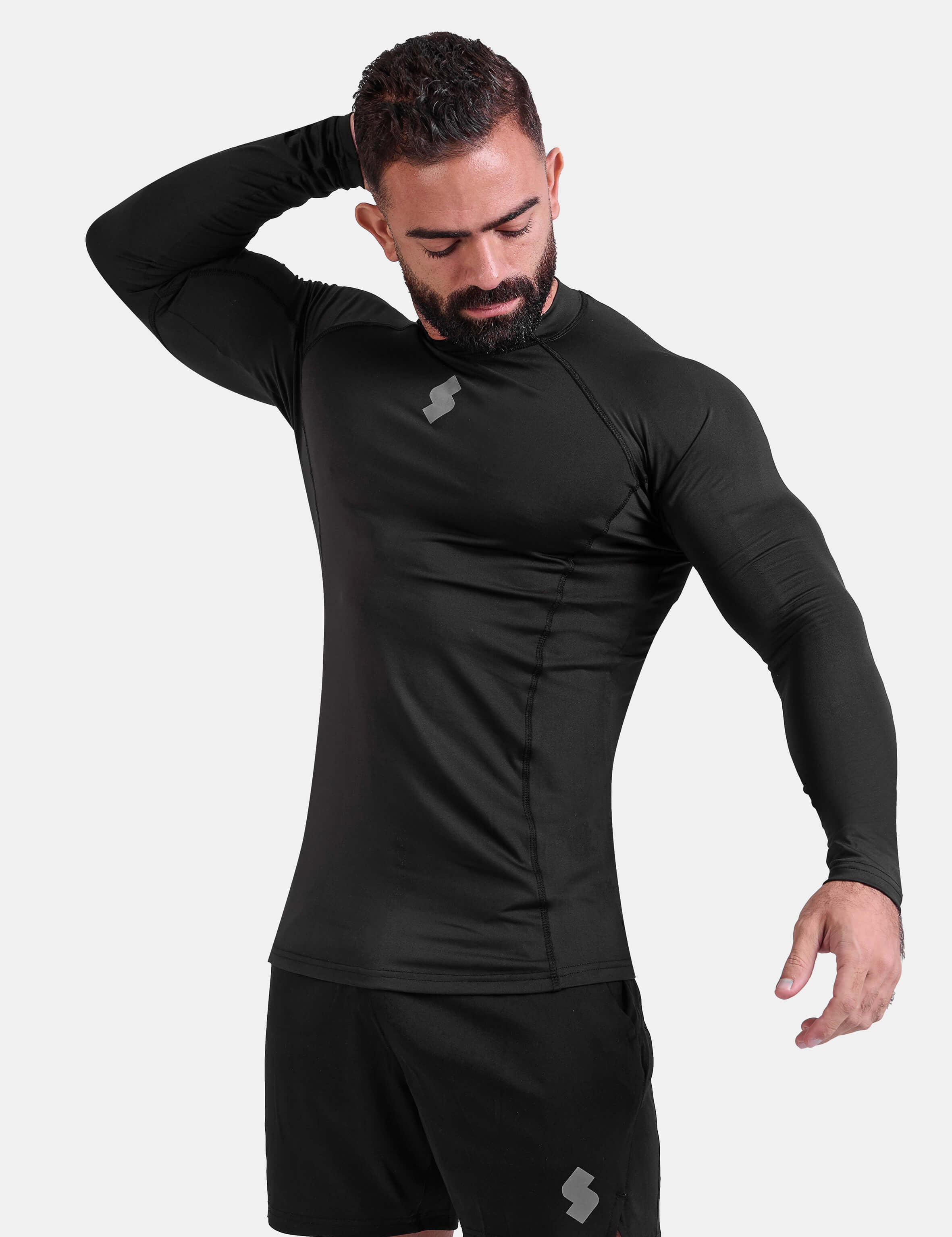 Man wearing black sports & gym rashguard shirt by KAF 