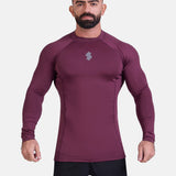 Man wearing burgundy sports & gym rashguard shirt by KAF 