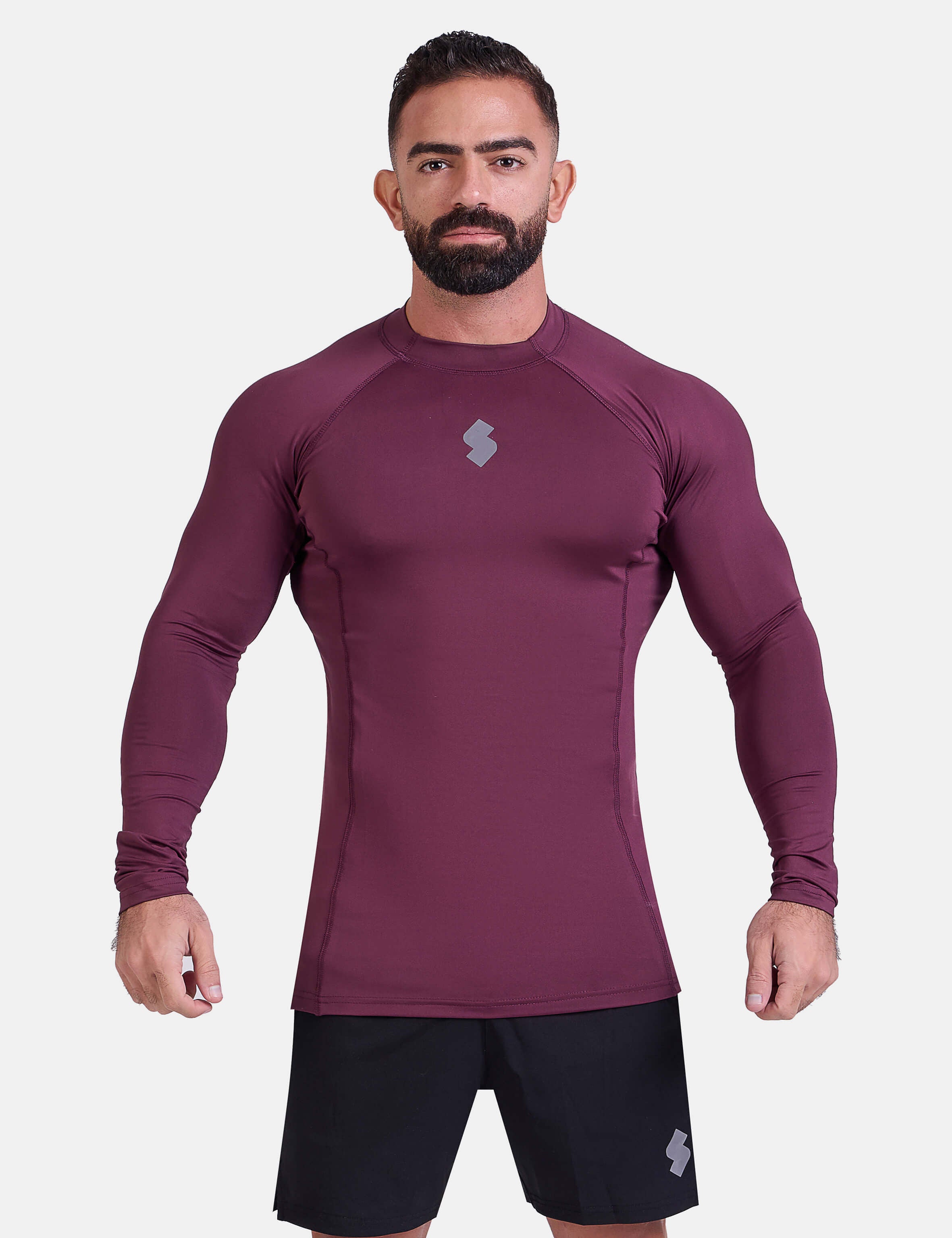 Man wearing burgundy sports & gym rashguard shirt by KAF 
