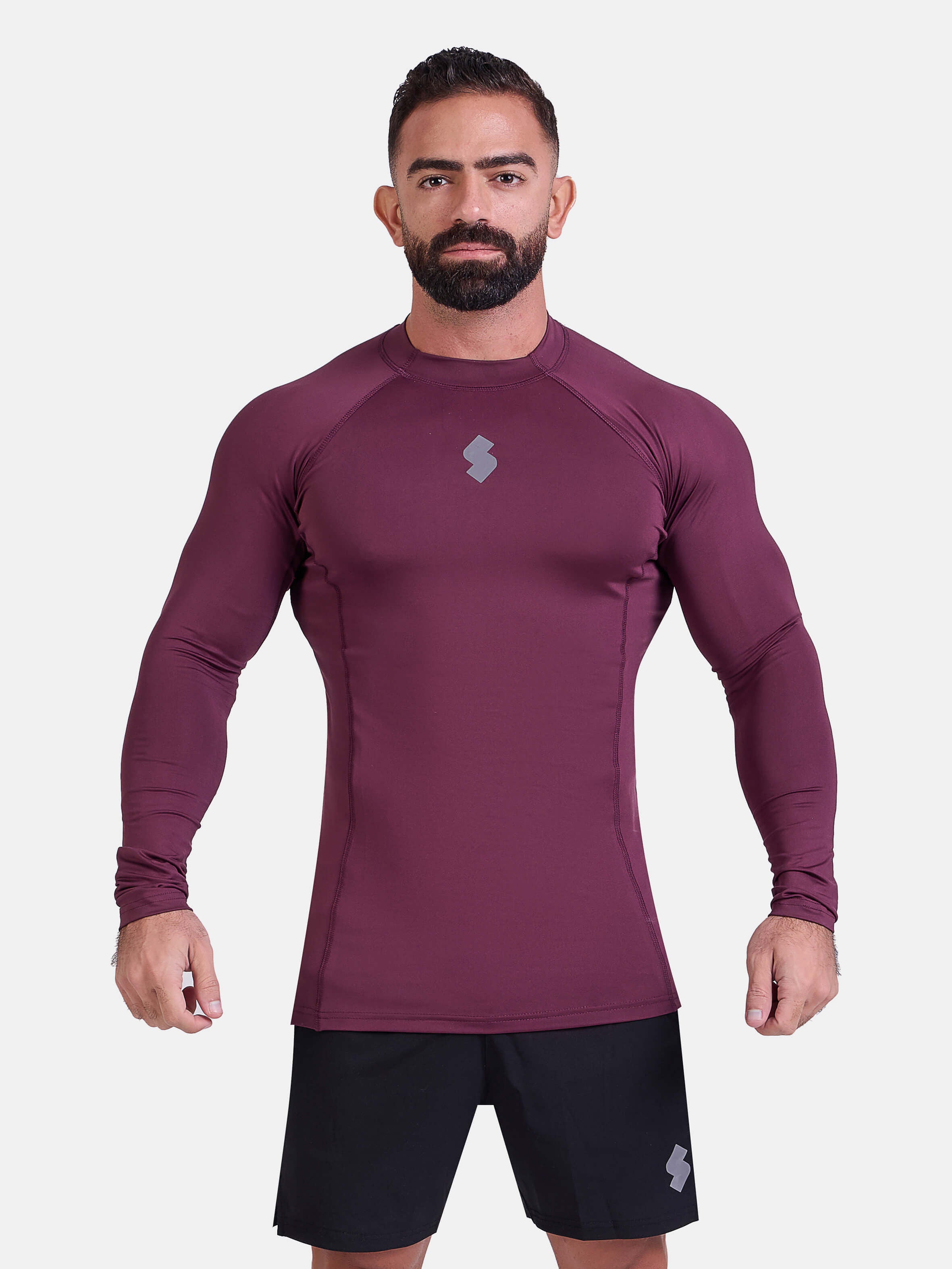 Man wearing burgundy sports & gym rashguard shirt by KAF 