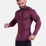 Man wearing burgundy sports & gym rashguard shirt by KAF 