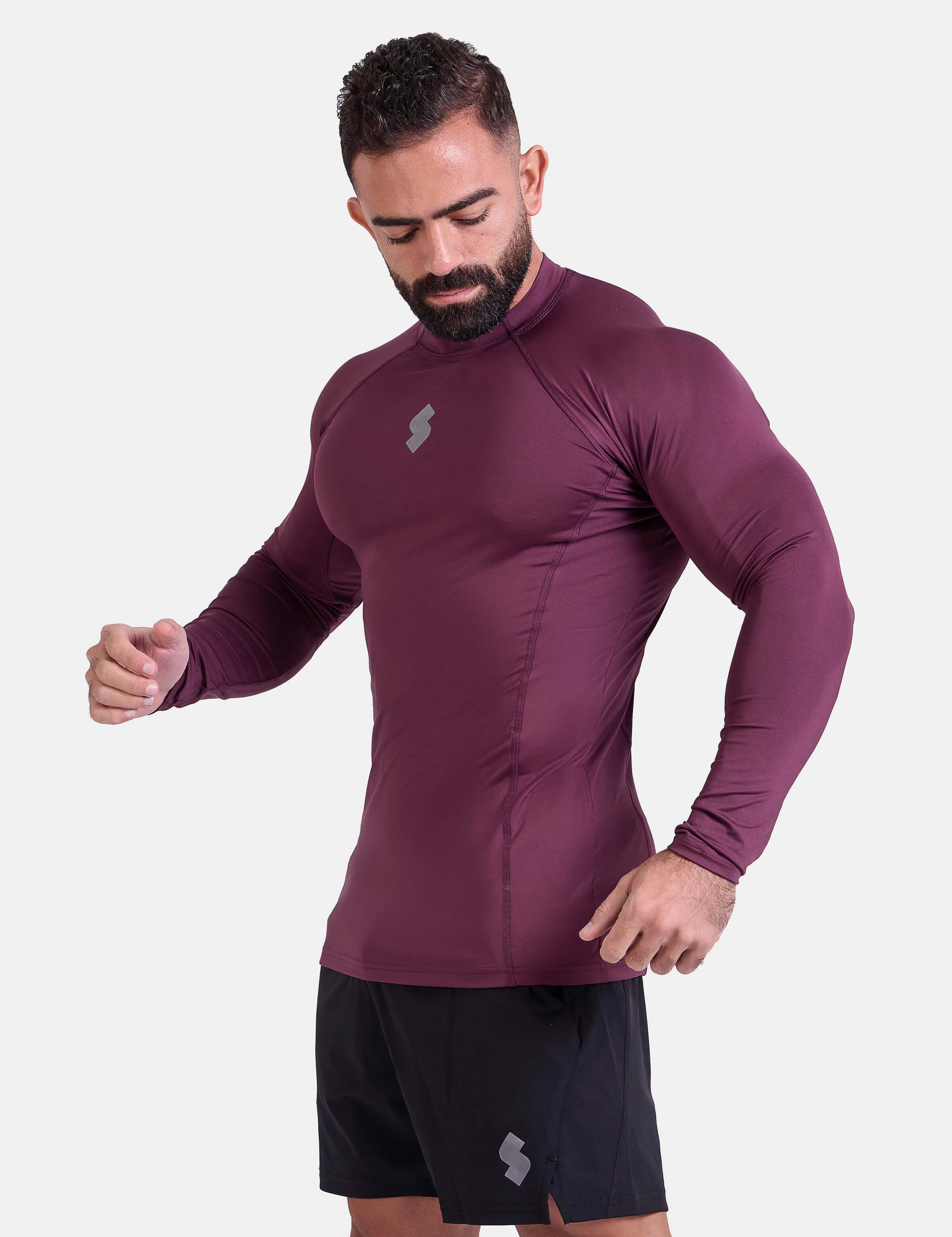 Man wearing burgundy sports & gym rashguard shirt by KAF 