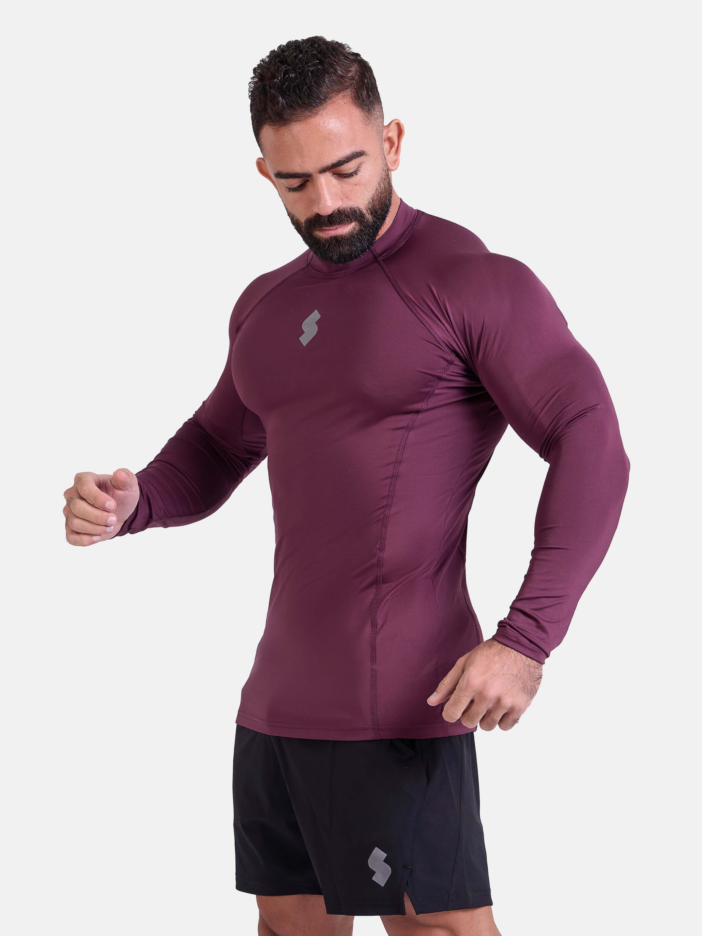 Man wearing burgundy sports & gym rashguard shirt by KAF 