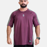 Man wearing a burgundy oversized sports & gym shirt by KAF 