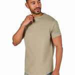 A male model wearing a raw-edged cotton crew neck t-shirt with short sleeves and a rounded hem.