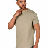 A male model wearing a raw-edged cotton crew neck t-shirt with short sleeves and a rounded hem.
