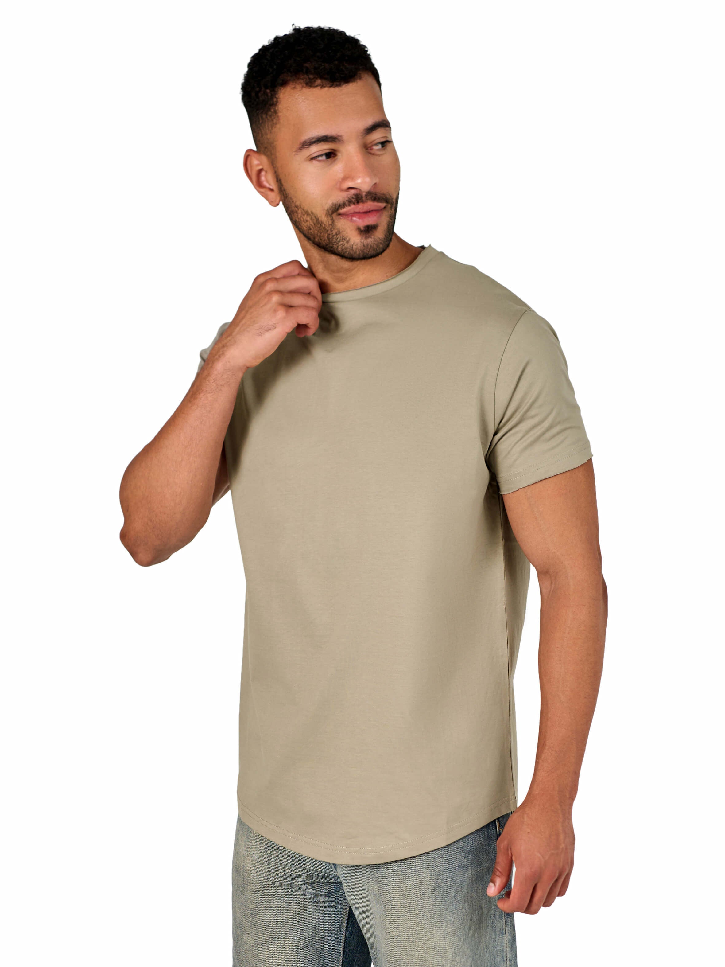 A male model wearing a raw-edged cotton crew neck t-shirt with short sleeves and a rounded hem.