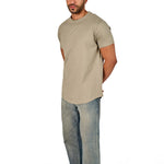 A male model wearing a raw-edged cotton crew neck t-shirt with short sleeves and a rounded hem.