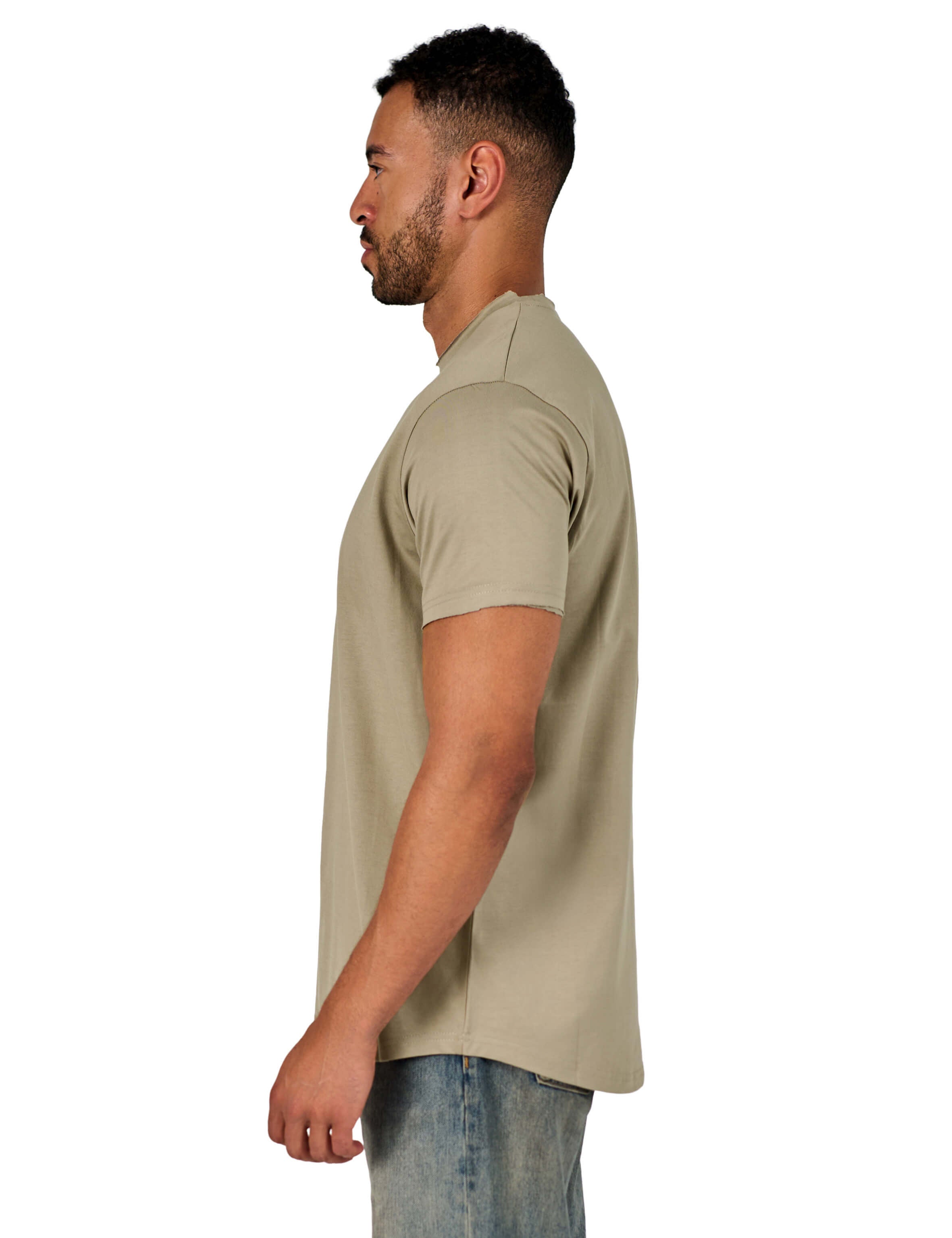 A male model wearing a raw-edged cotton crew neck t-shirt with short sleeves and a rounded hem.
