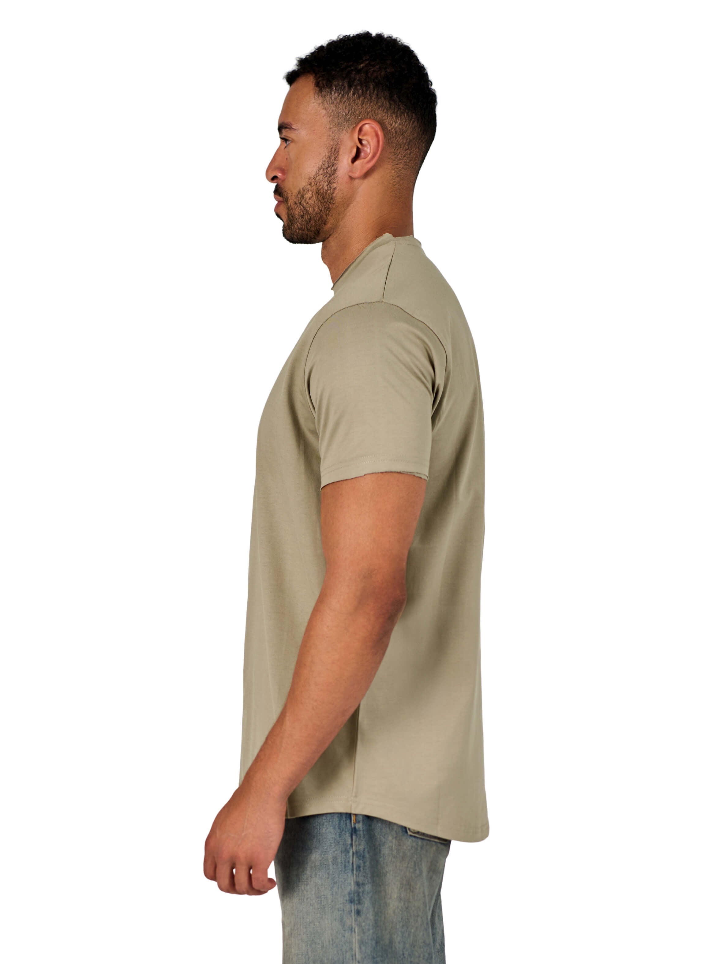 A male model wearing a raw-edged cotton crew neck t-shirt with short sleeves and a rounded hem.
