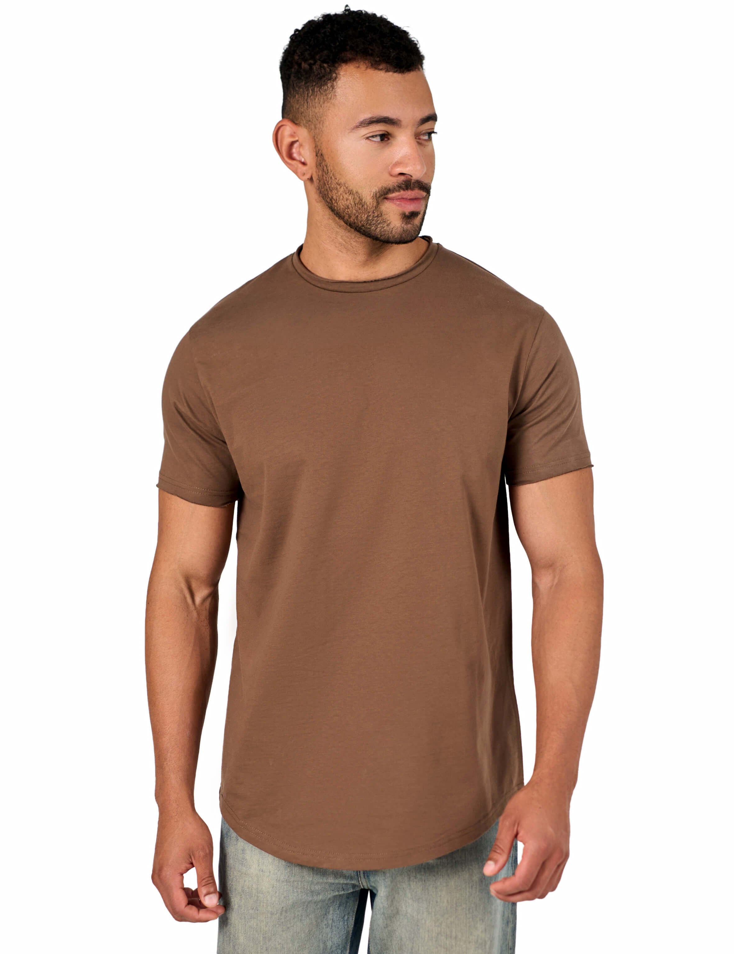 A male model wearing a raw-edged cotton crew neck t-shirt with short sleeves and a rounded hem.