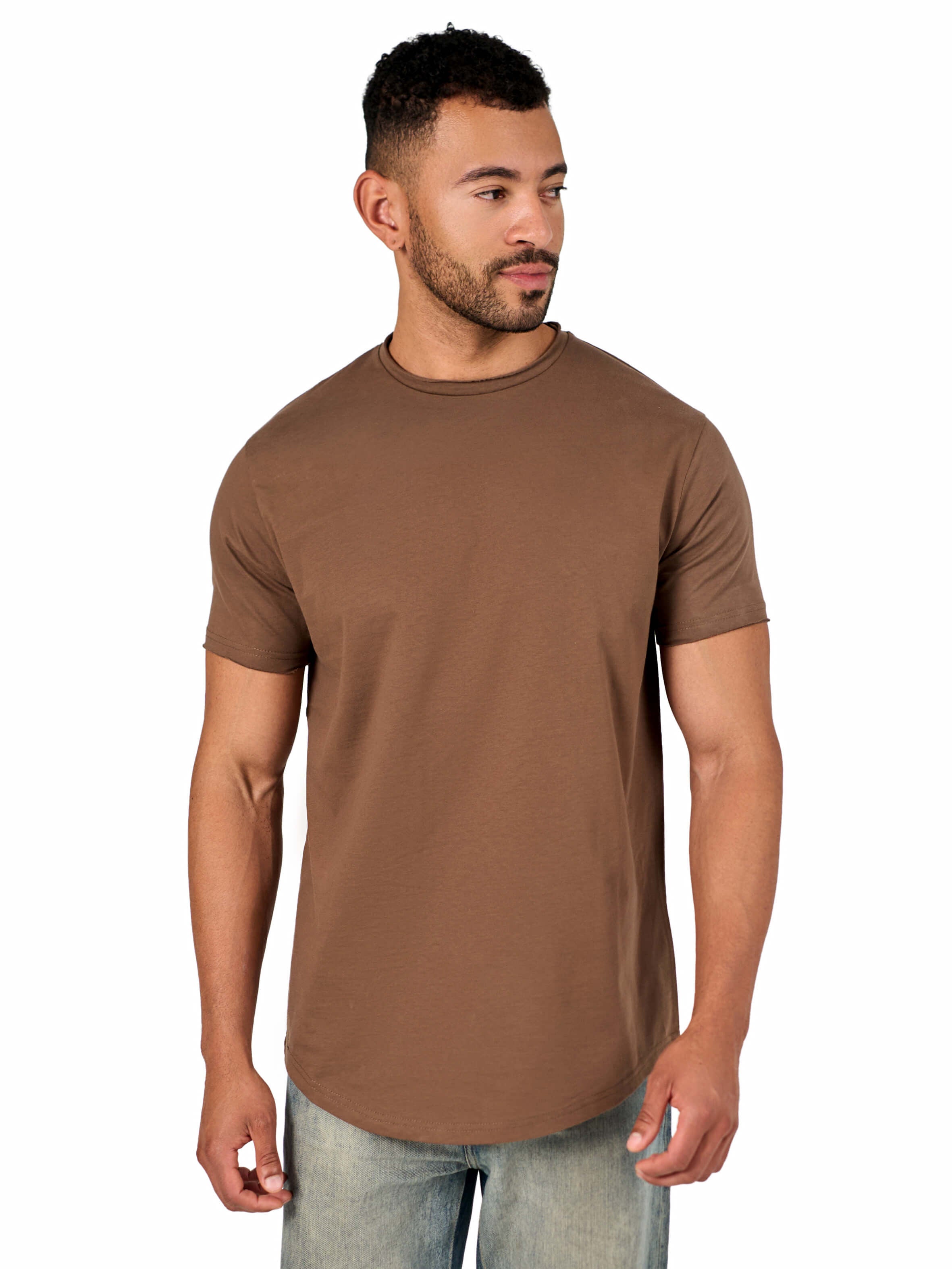 A male model wearing a raw-edged cotton crew neck t-shirt with short sleeves and a rounded hem.
