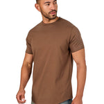 A male model wearing a raw-edged cotton crew neck t-shirt with short sleeves and a rounded hem.