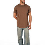 A male model wearing a raw-edged cotton crew neck t-shirt with short sleeves and a rounded hem.