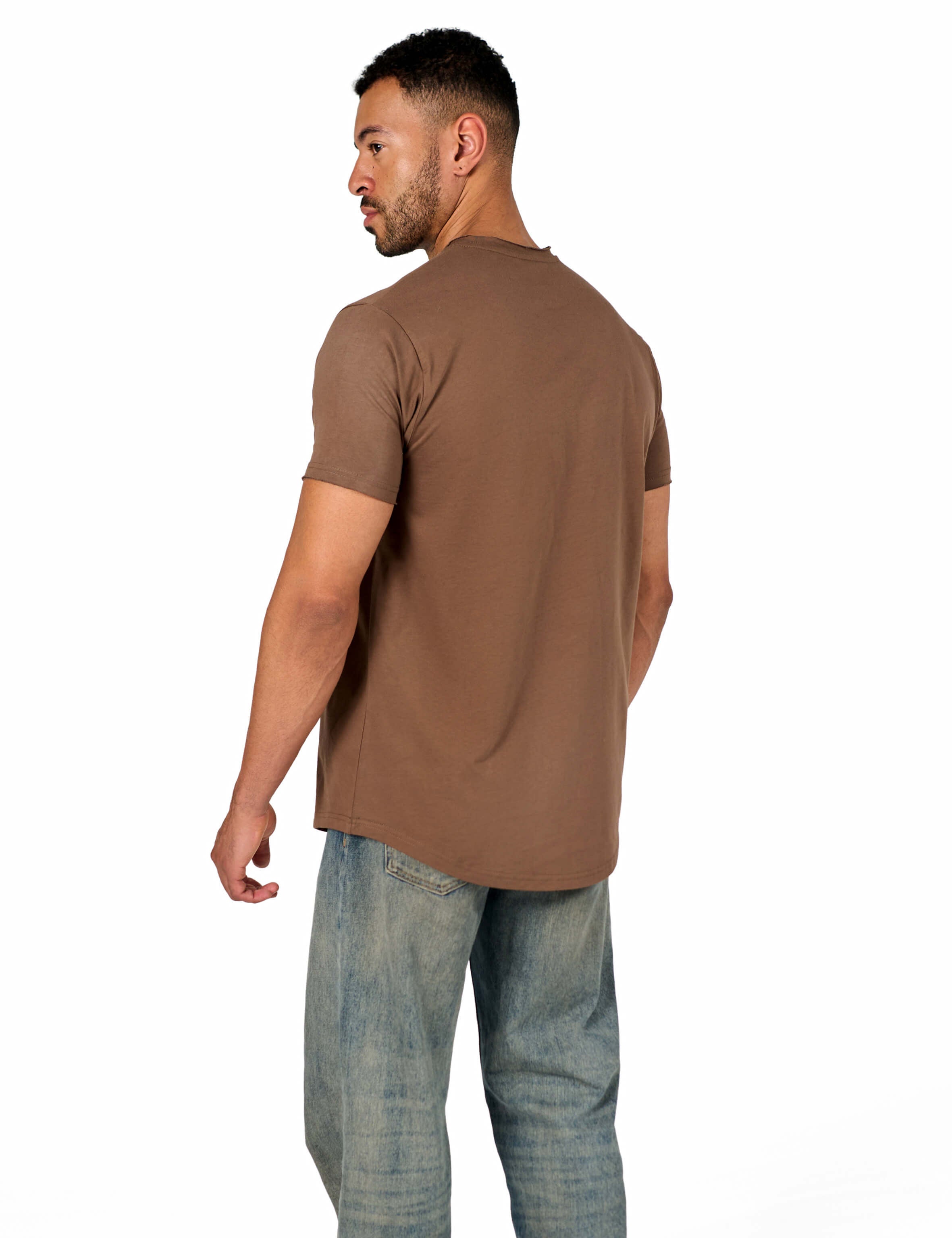 A male model wearing a raw-edged cotton crew neck t-shirt with short sleeves and a rounded hem.