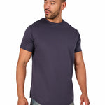 A male model wearing a raw-edged cotton crew neck t-shirt with short sleeves and a rounded hem.