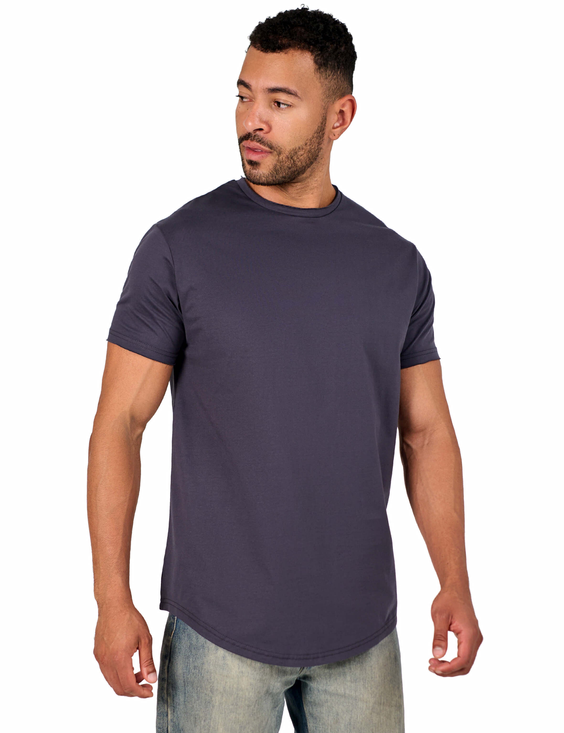 A male model wearing a raw-edged cotton crew neck t-shirt with short sleeves and a rounded hem.