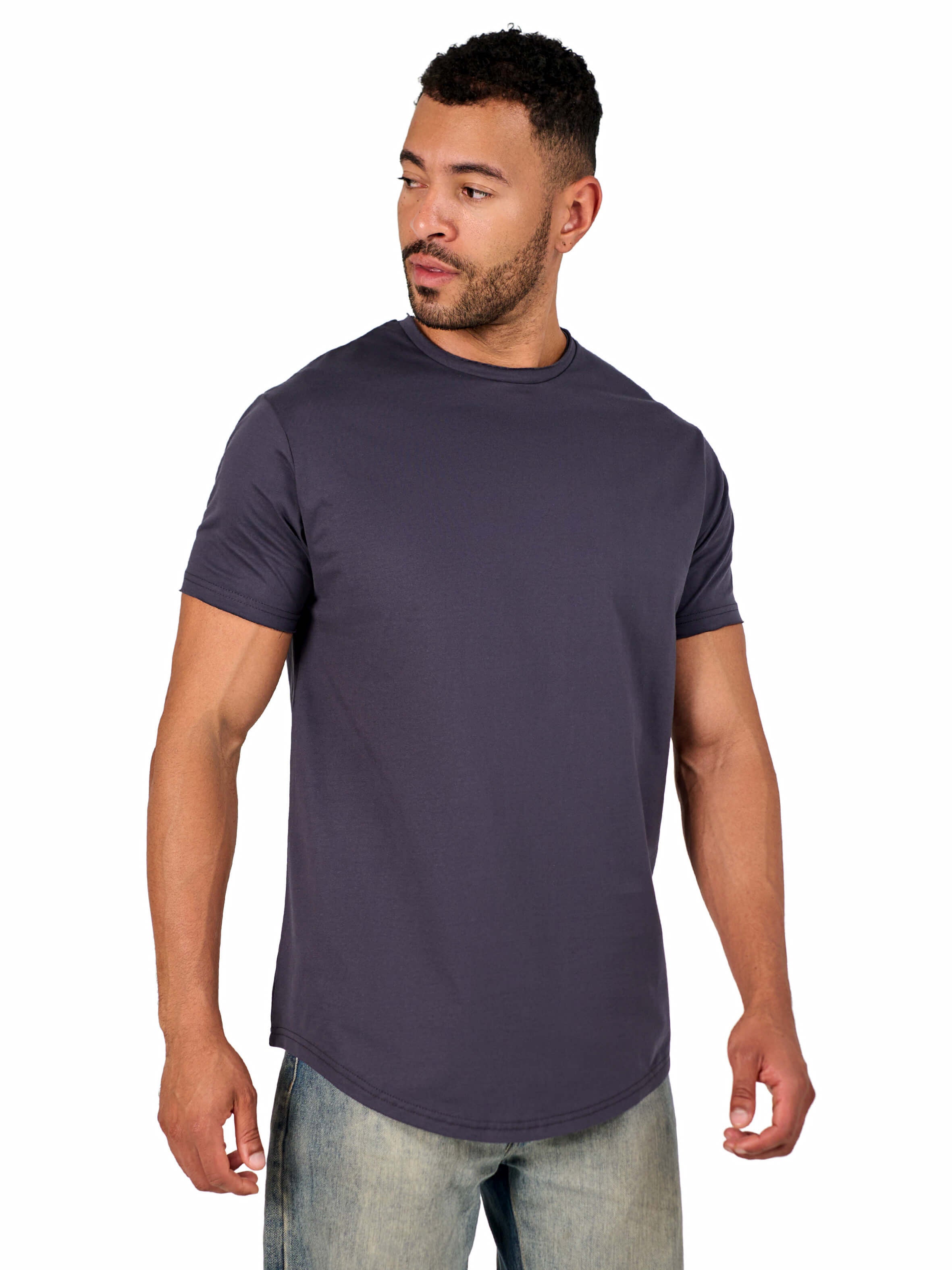 A male model wearing a raw-edged cotton crew neck t-shirt with short sleeves and a rounded hem.
