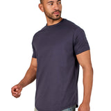 A male model wearing a raw-edged cotton crew neck t-shirt with short sleeves and a rounded hem.