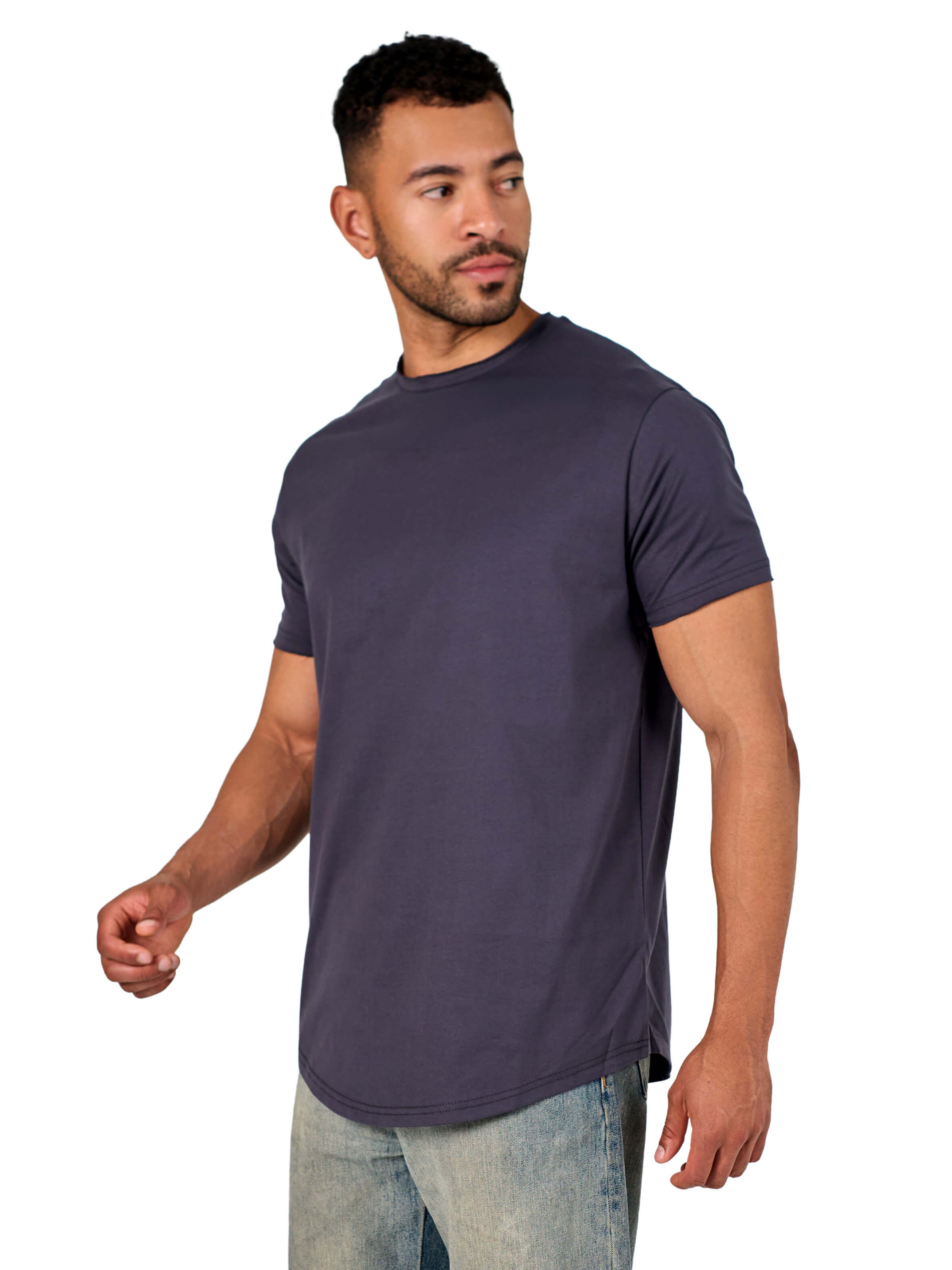 A male model wearing a raw-edged cotton crew neck t-shirt with short sleeves and a rounded hem.