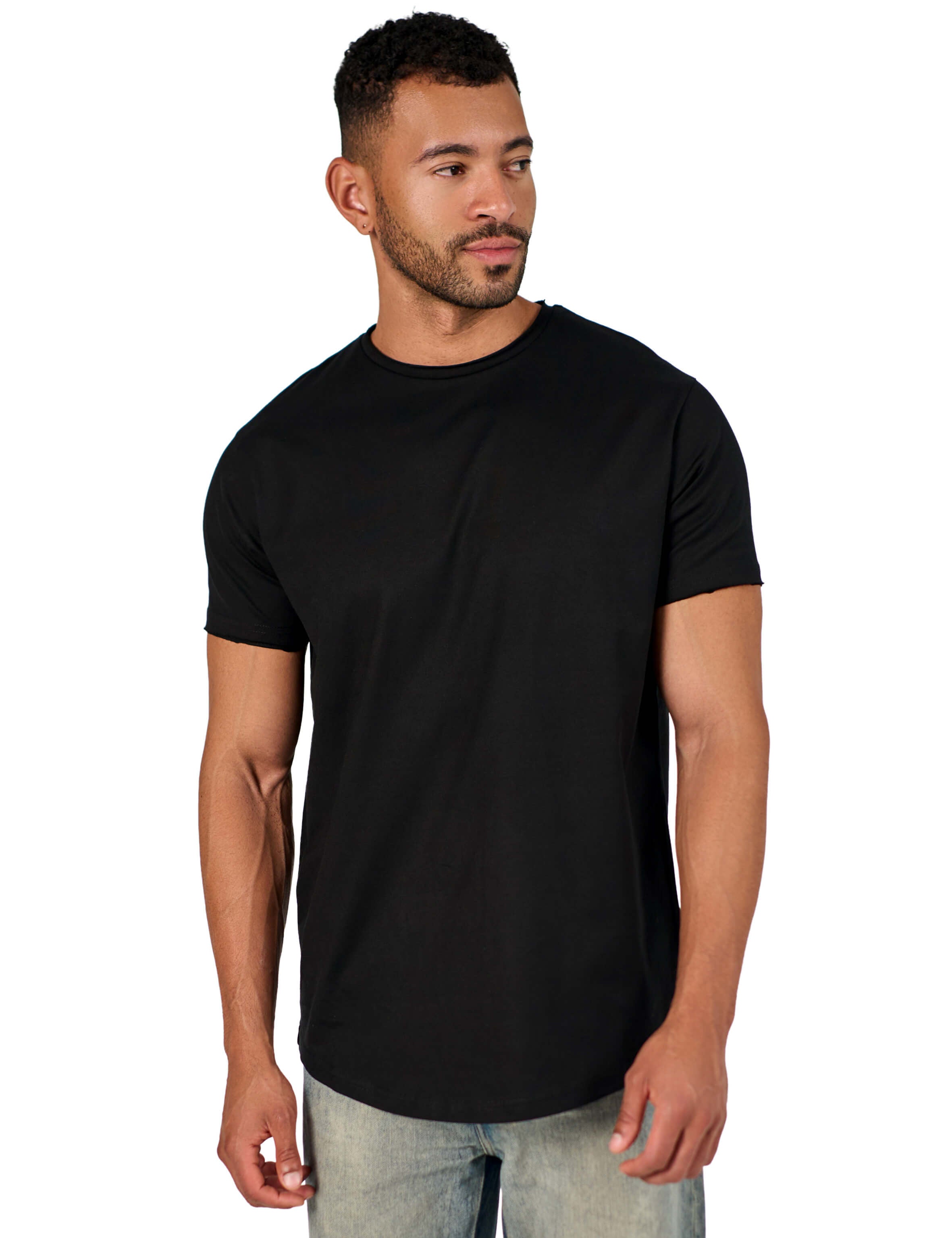 A male model wearing a black raw-edged cotton crew neck t-shirt with short sleeves and a rounded hem.