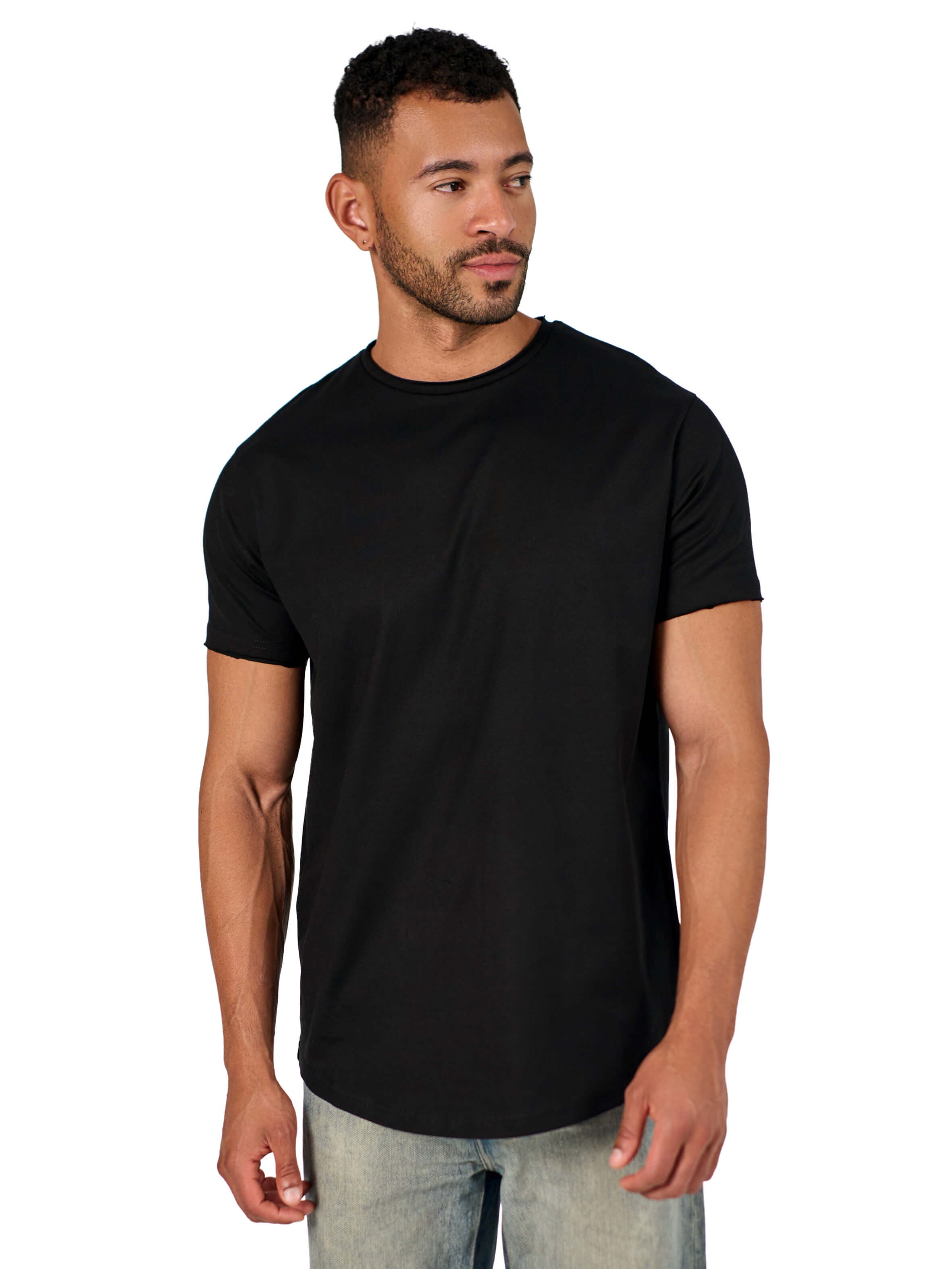 A male model wearing a black raw-edged cotton crew neck t-shirt with short sleeves and a rounded hem.