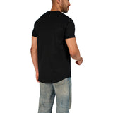A male model wearing a black raw-edged cotton crew neck t-shirt with short sleeves and a rounded hem.