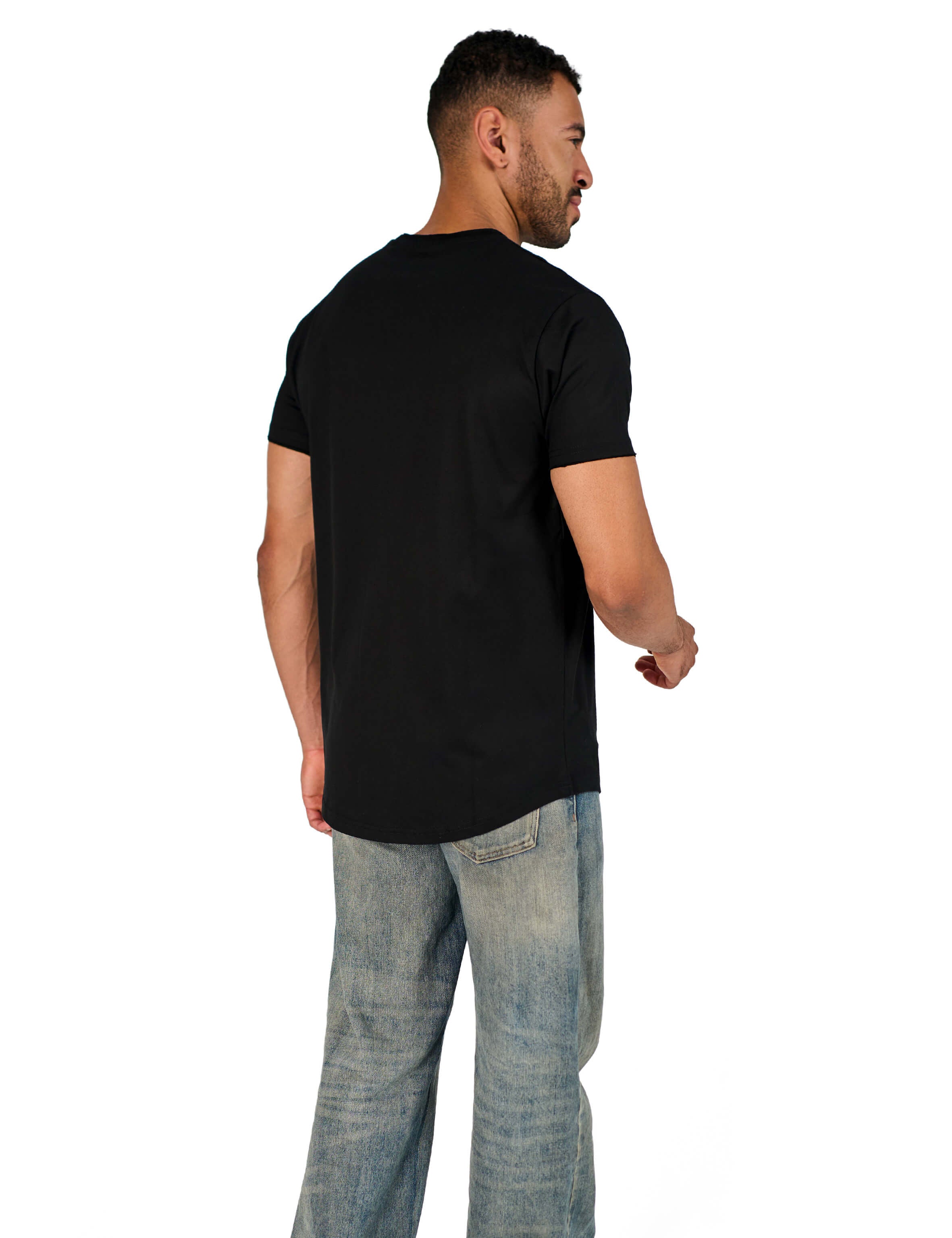 A male model wearing a black raw-edged cotton crew neck t-shirt with short sleeves and a rounded hem.