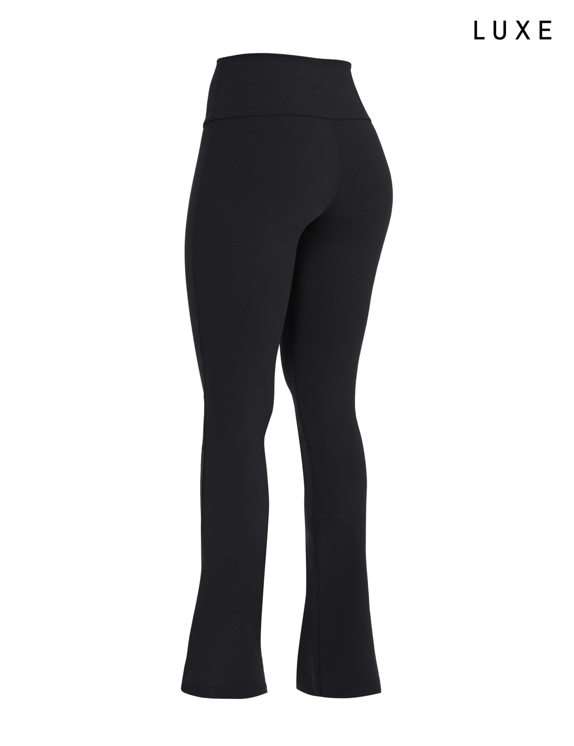 Black sports activewear buttery-soft flared pants by KAF on a white background with 'LUXE' branding.