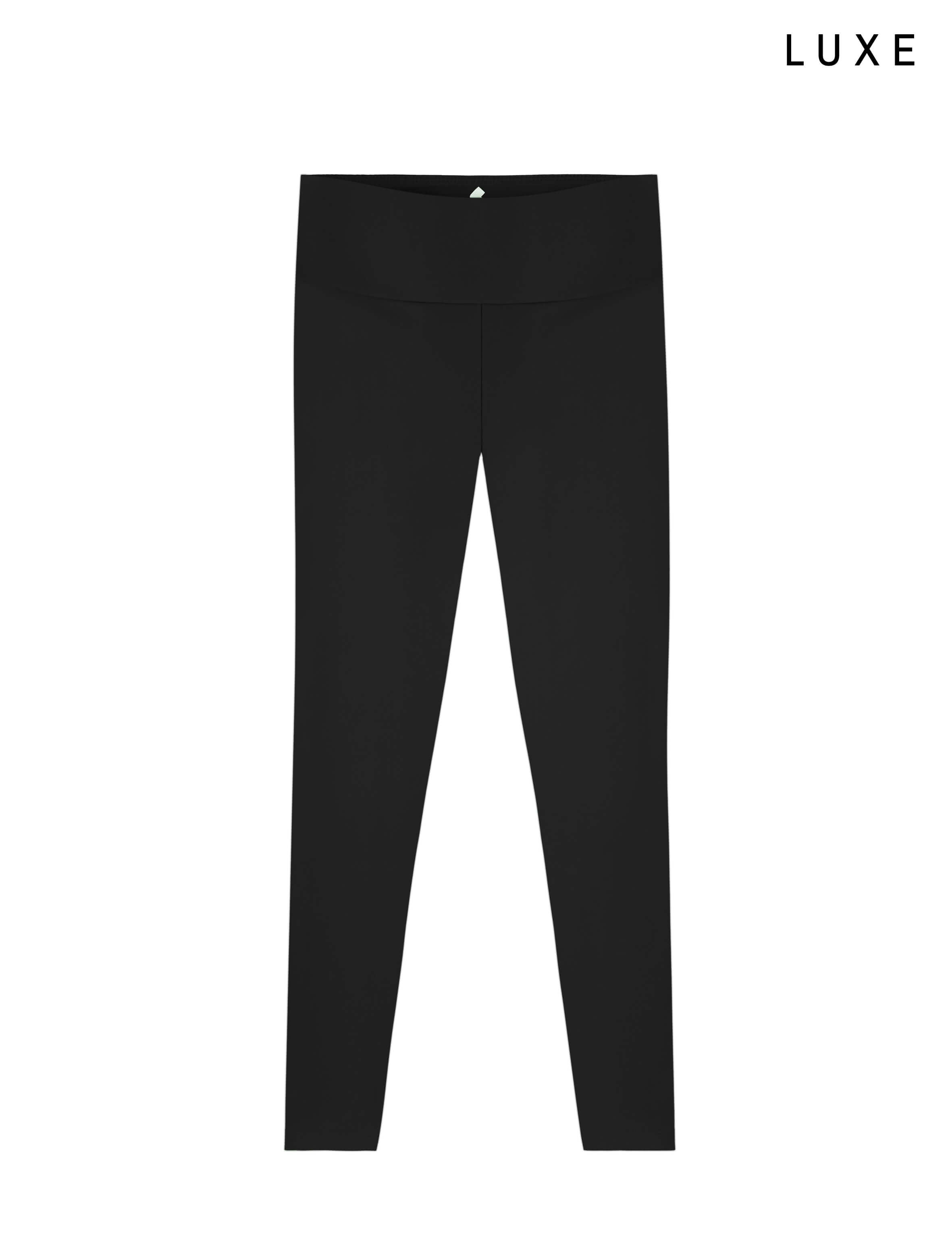 Black leggings on a white background with 'LUXE' branding.