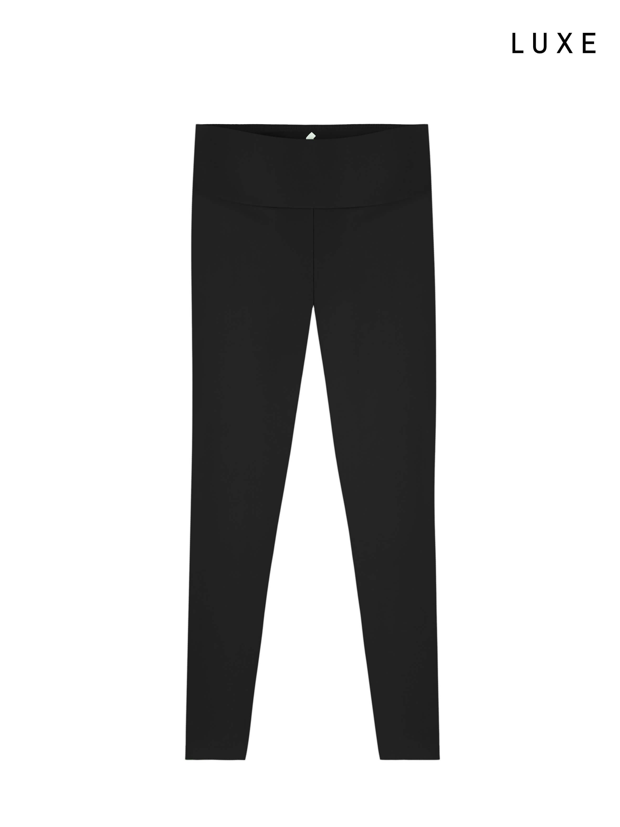 Black leggings on a white background with 'LUXE' branding.