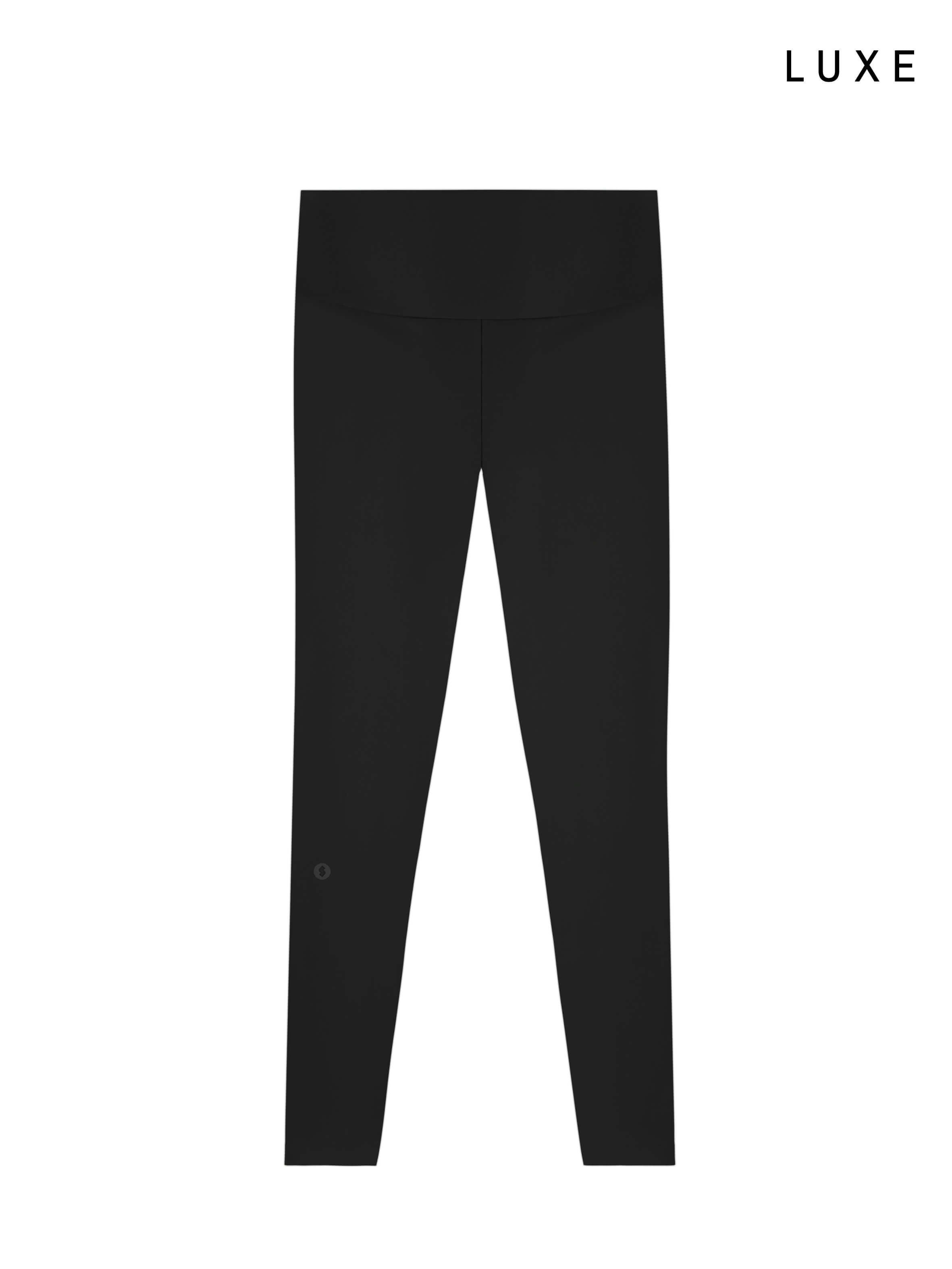 Black leggings on a white background with 'LUXE' branding.
