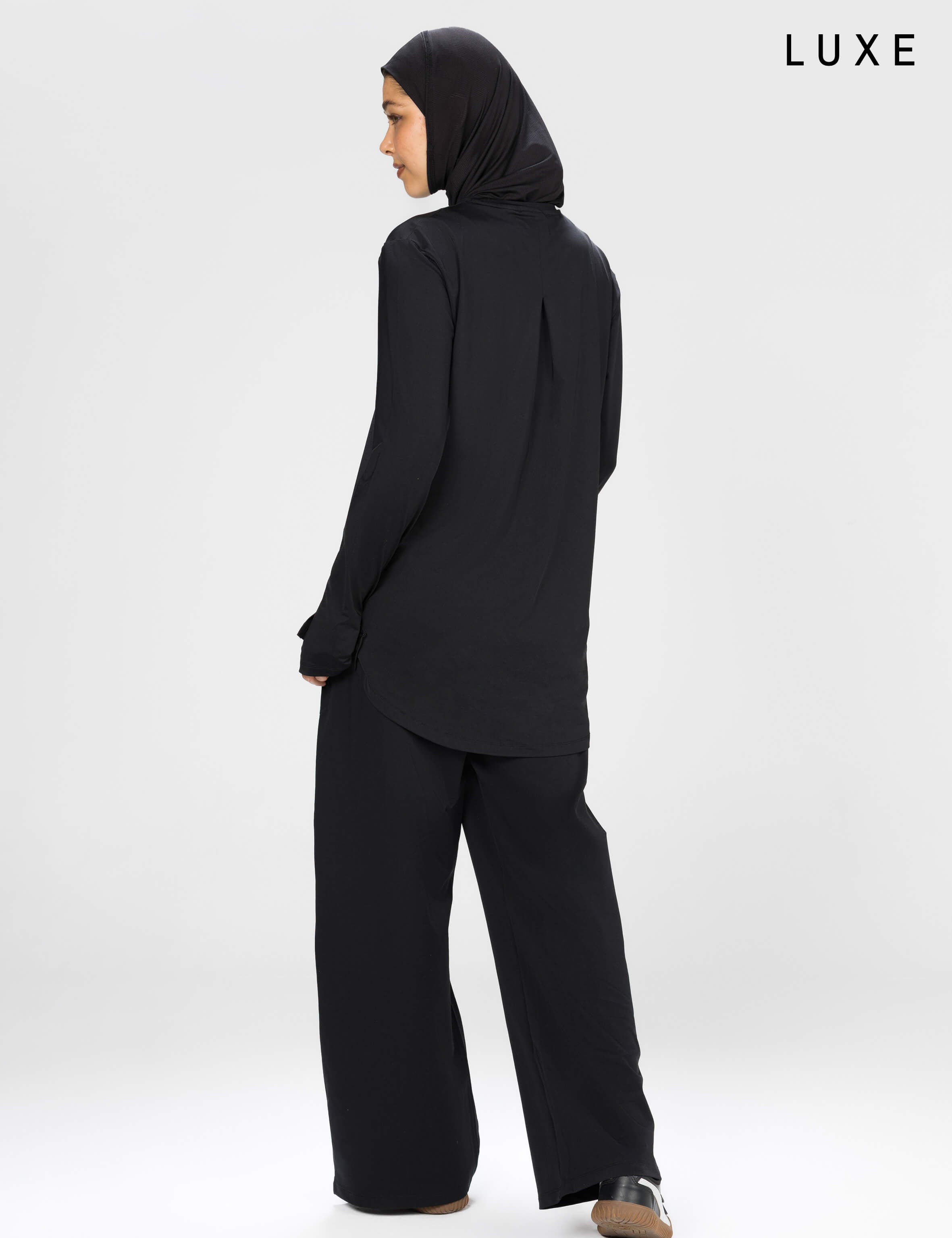 Women black long-sleeve modest sports activewear top by KAF