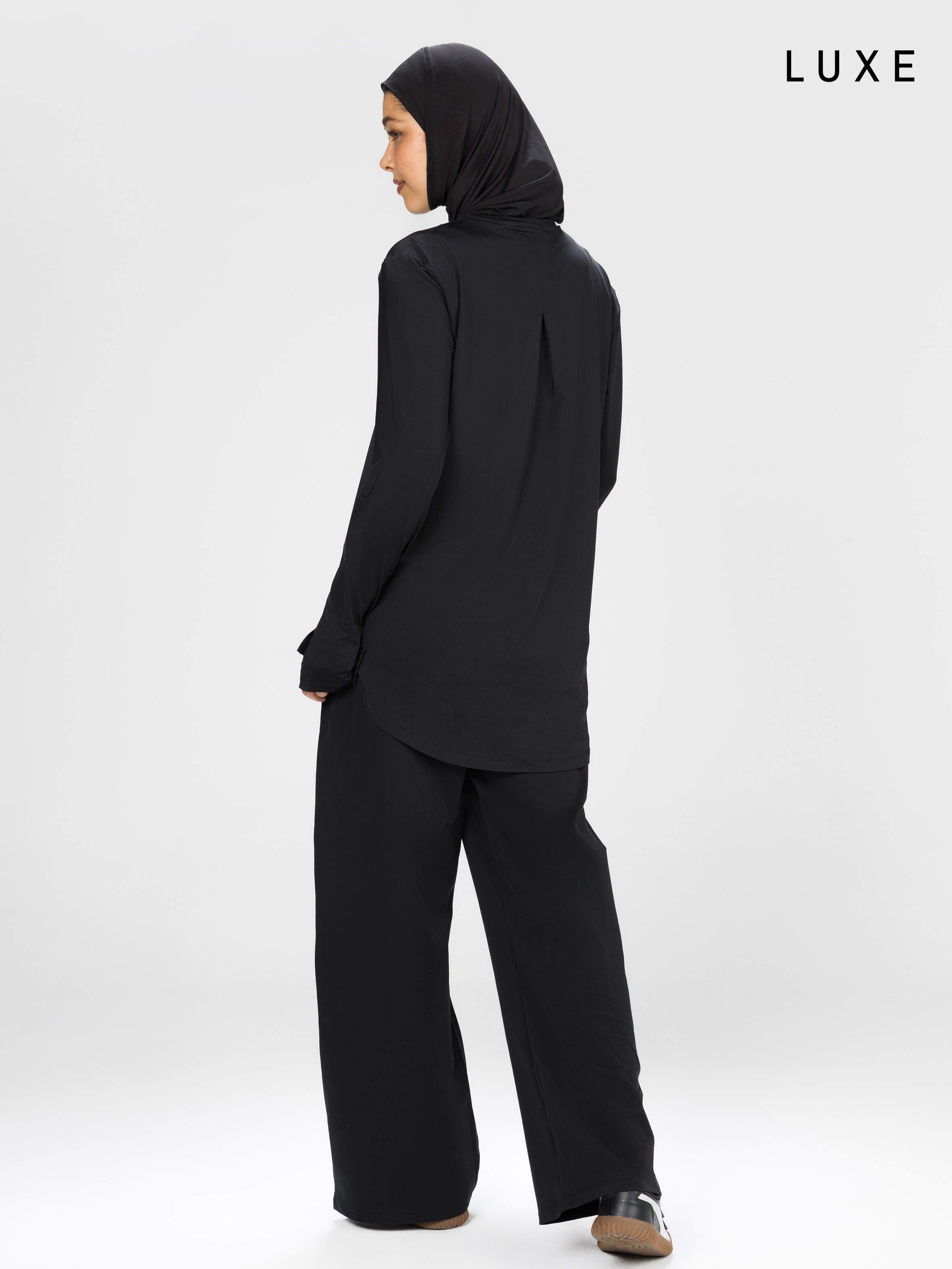 Women black long-sleeve modest sports activewear top by KAF