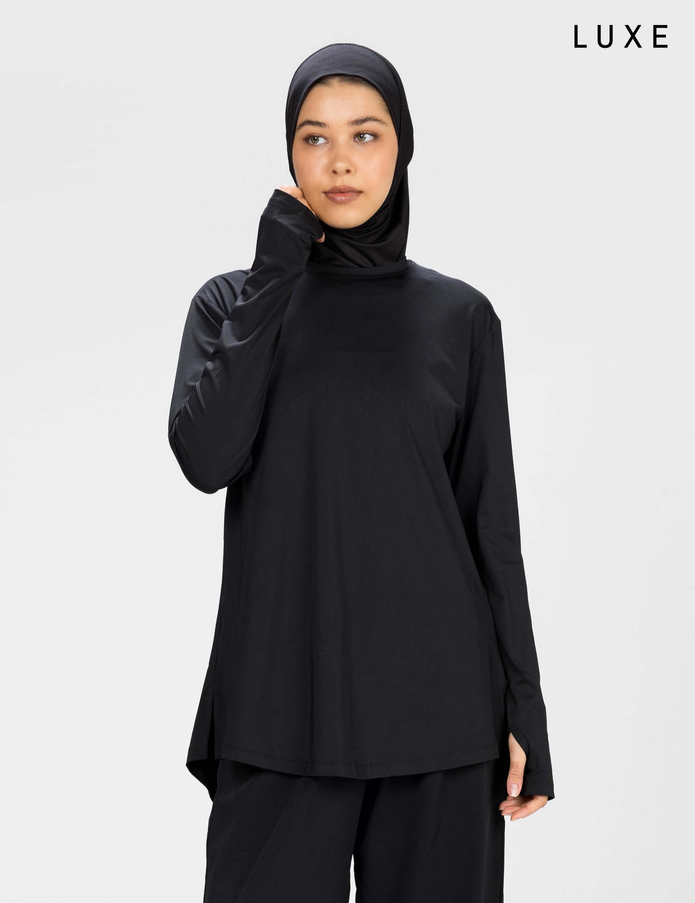 Women black long-sleeve modest sports activewear top by KAF